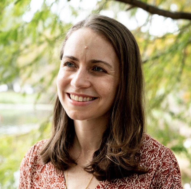 Erin Strenio (she\her) smiling at the camera